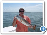 This young Lady is giving the guys a run for thier money with this nice red fish.
