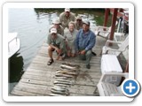 These guys can't wait to get these fish on the fire. 